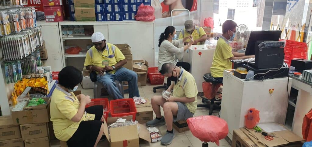 A group of clients from the S P D Day Activity Centre helping out at a supermarket