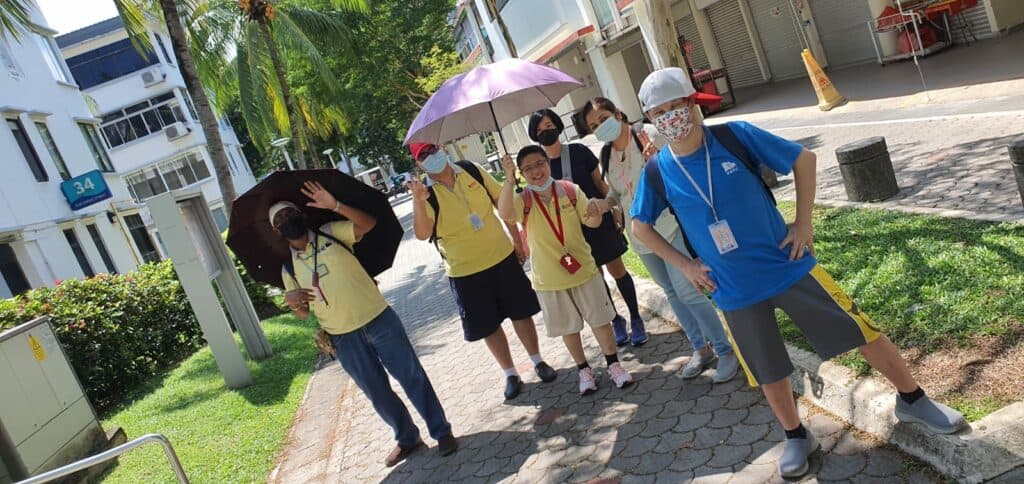 Volunteer Ms Deepti Dongre with 4 day activity centre clients taking a walk around the tiong bahru neighbourhood