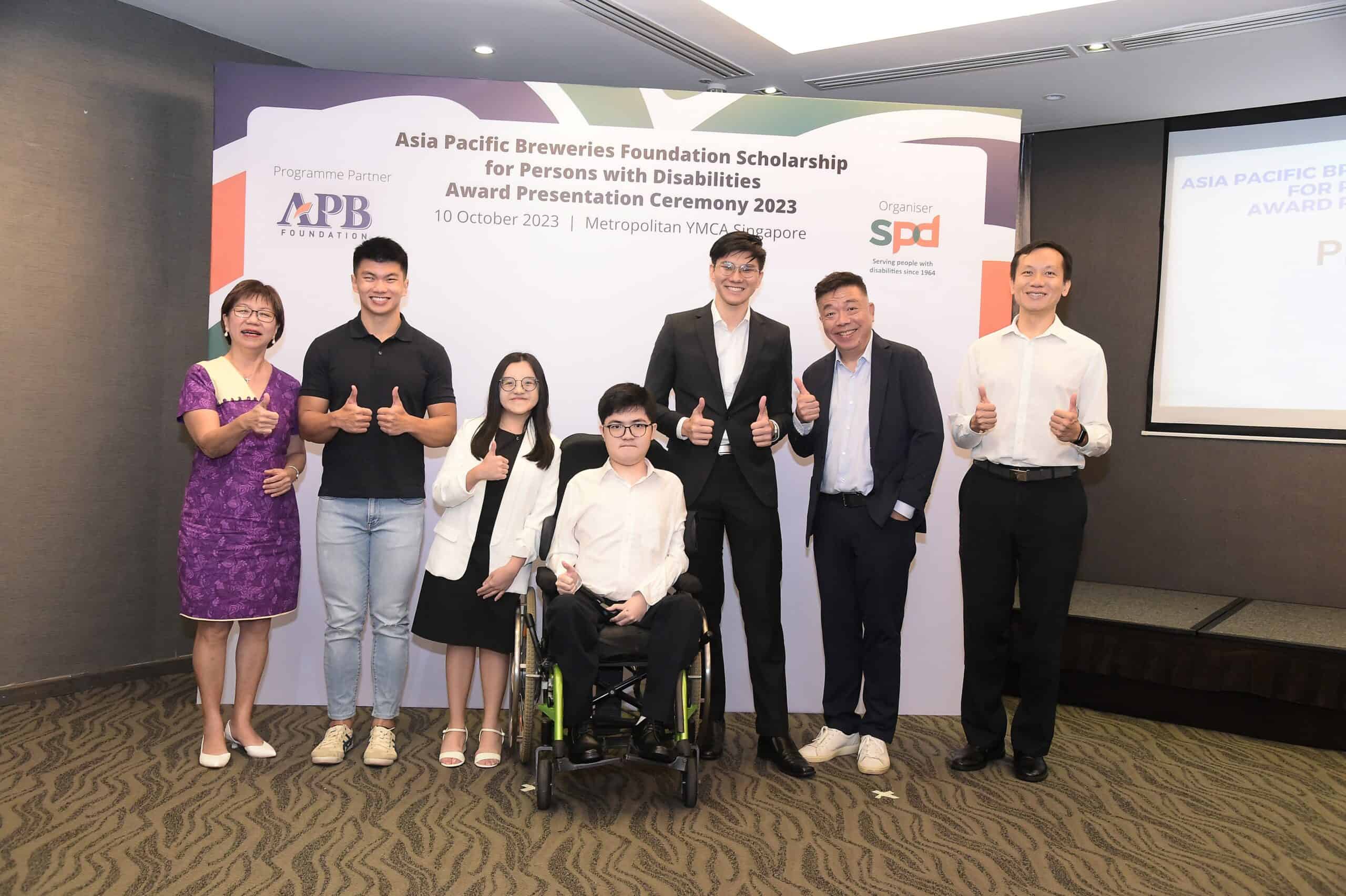 From left - GOH Ms Denise Phua, scholarship recipients Marcus Lim, Magdelene Tong, Aaron Sim and Bjorn Ng, APB Foundation Chariman Mr Kenneth Choo, SPD Board Member Mr Tang Liheng