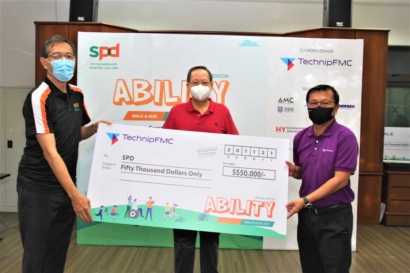 GOH at the Cheque Presentation with SPD President Winston Ngan and TechnipFMC Roger Tan 1