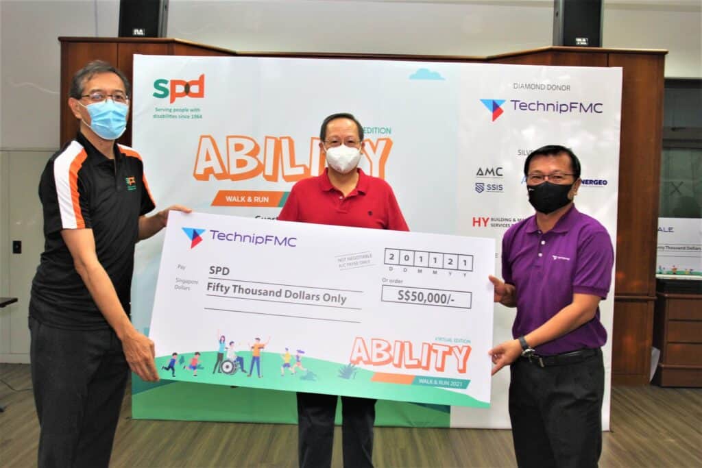 GOH at the Cheque Presentation with SPD President Winston Ngan and TechnipFMC Roger Tan