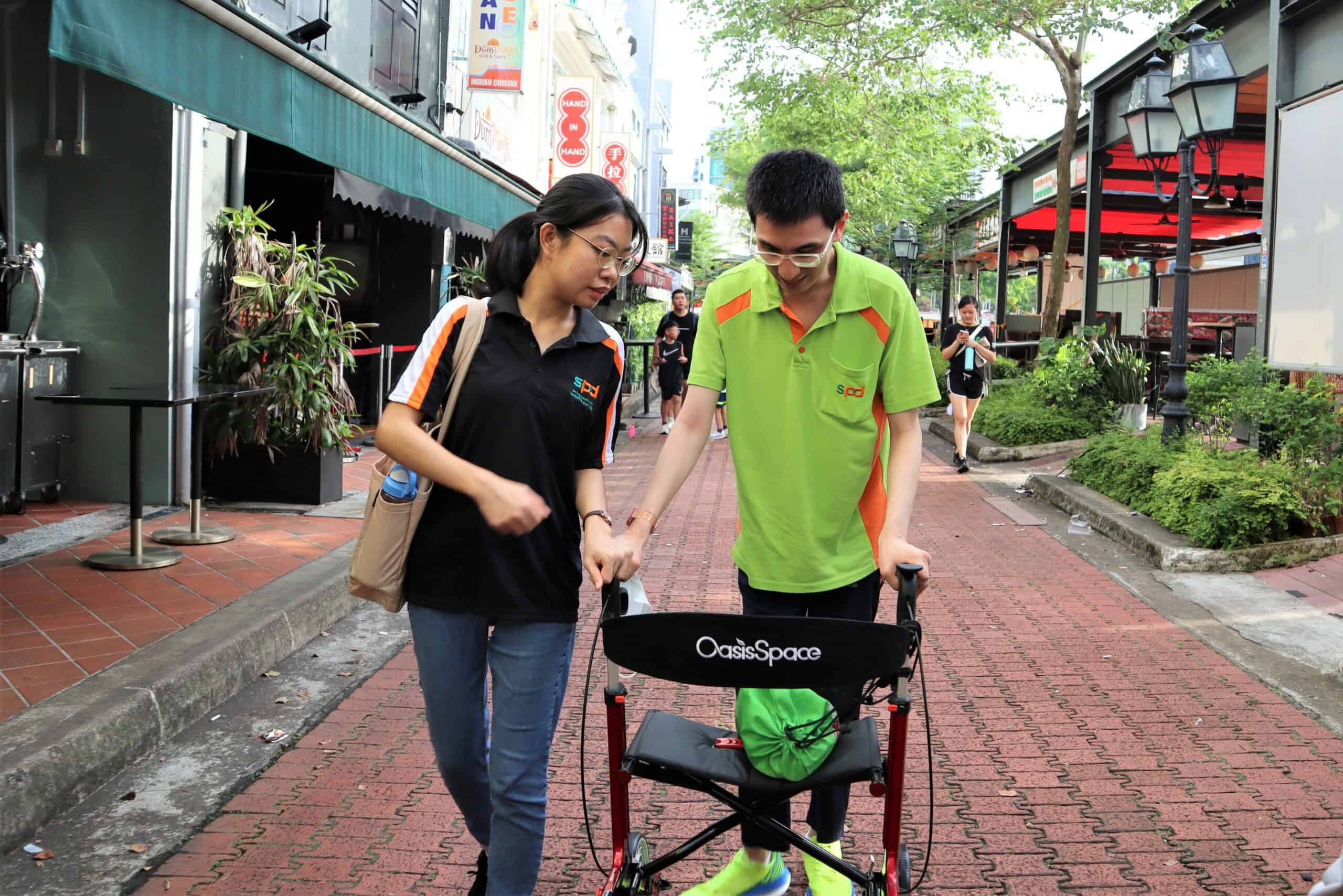 A S P D O T walking with her client