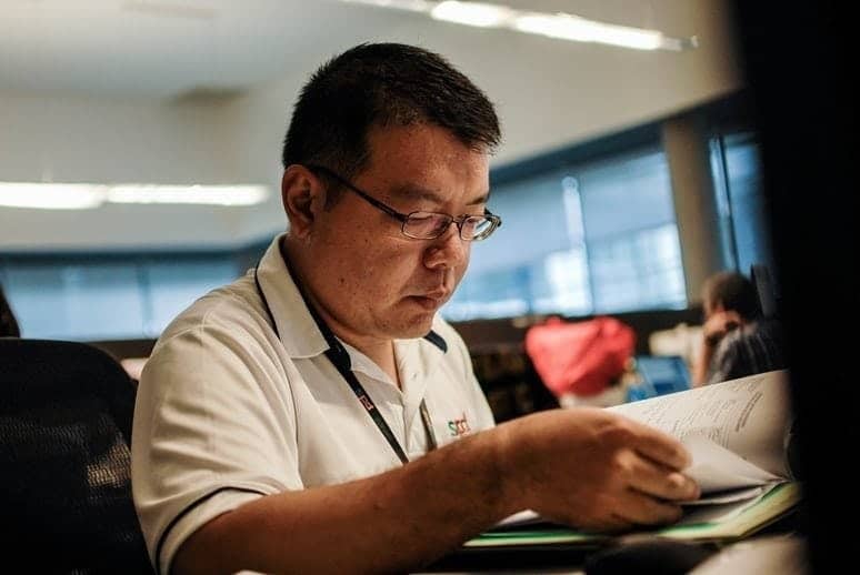 Social worker reading a book