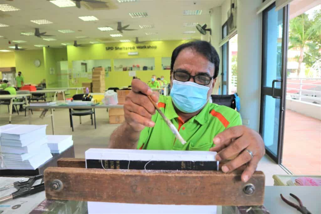 Hussain working at the S P D Sheltered Workshop as a craftsman