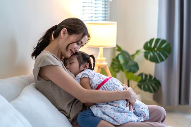 Mother with her sleeping child