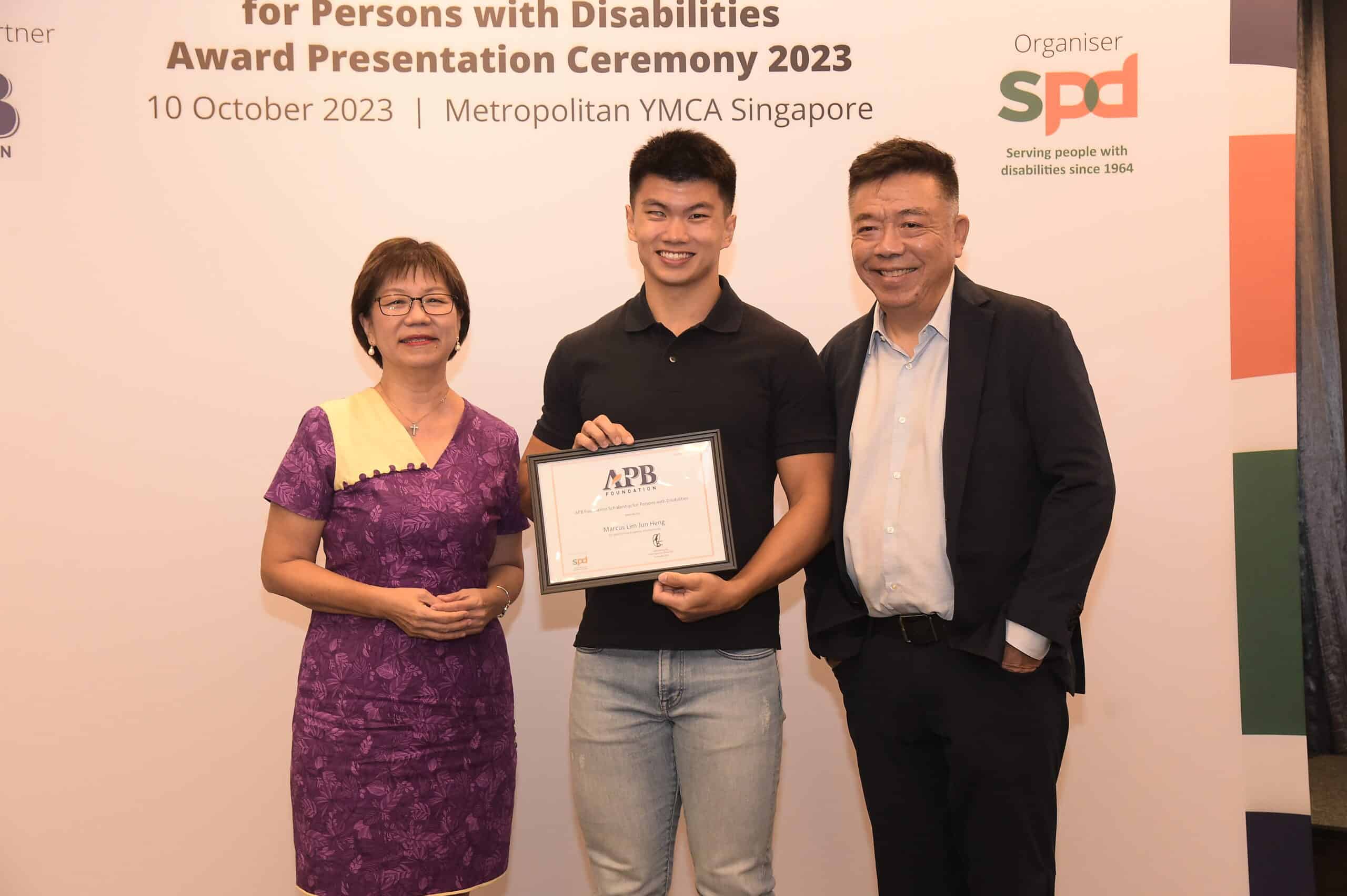 From left - GOH Ms Denise Phua, scholarship recipient Marcus Lim, Chairman, Board of Trustees, APB Foundation Mr Kenneth Choo