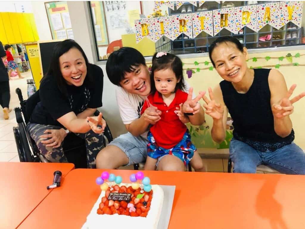 Jean and family celebrating Summer's birthday in school 