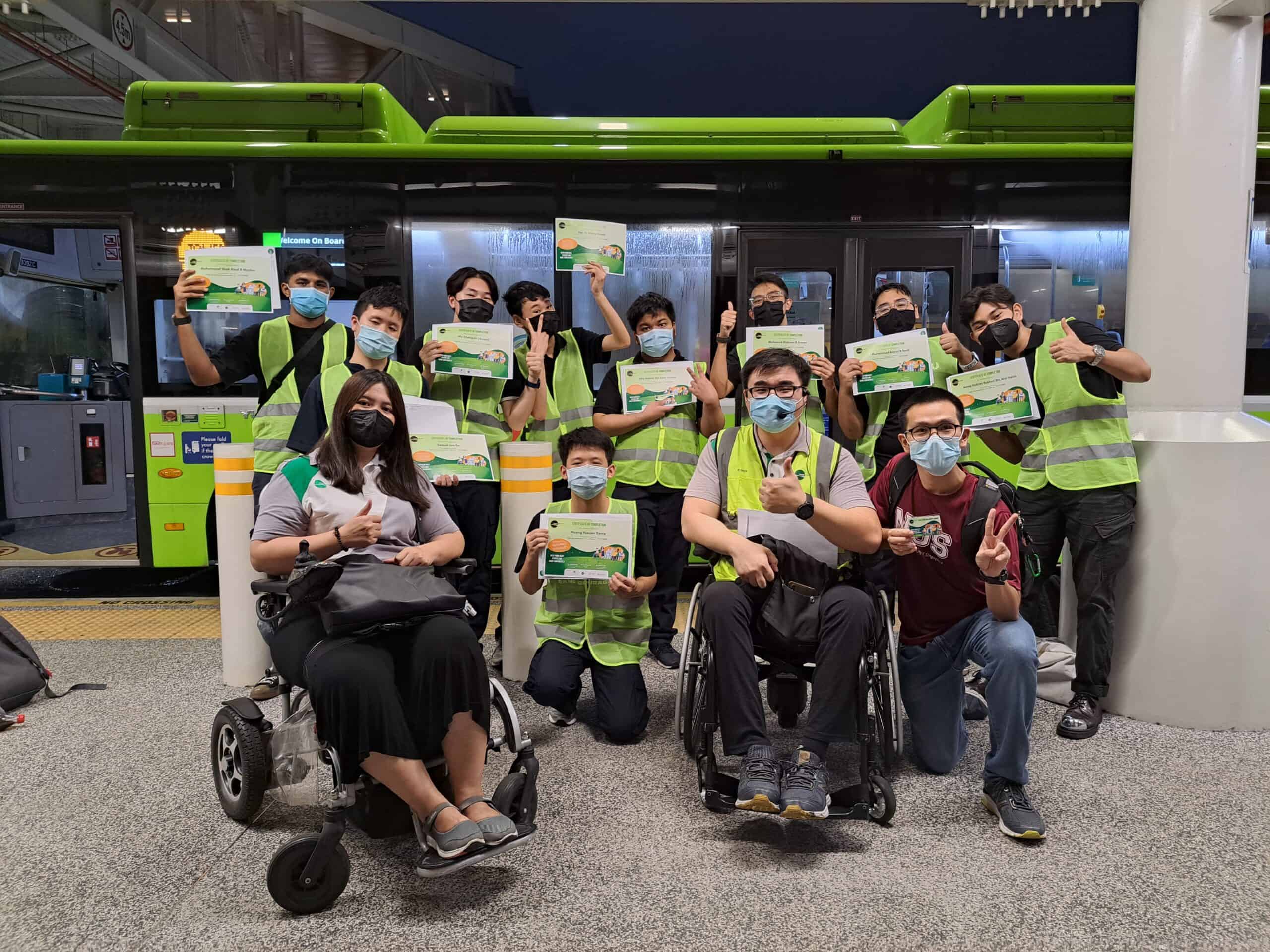 William taking a group photo with the Tower Transit staff and participants of the Public Bus Inclusivity Course.