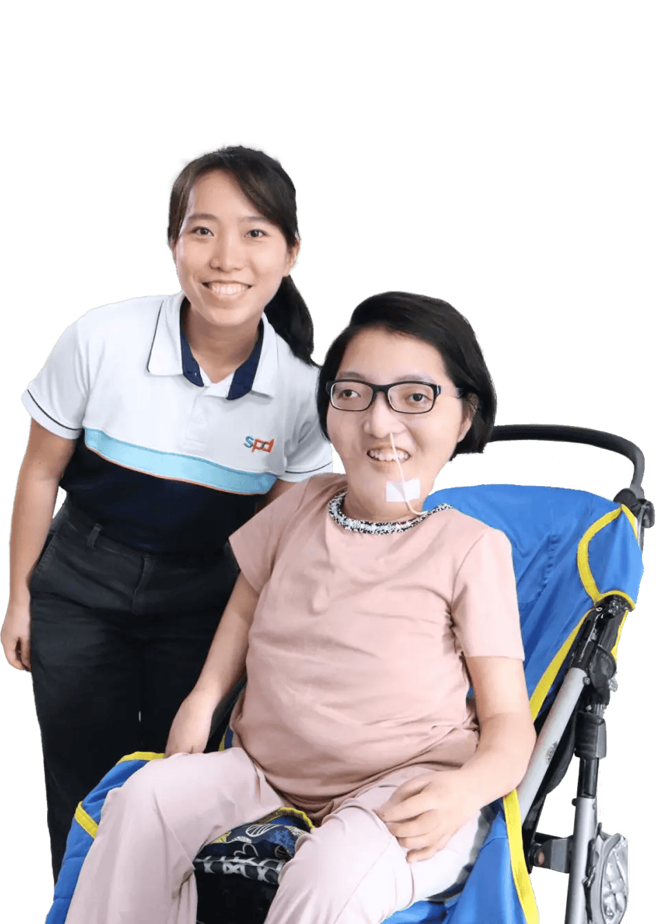 An S P D social worker and a young bespectacled with a feeding tube in a her nose seated in a pram, both smiling.