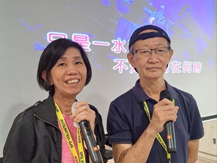 Supporting seniors with heart, connection and purpose 7 Volunteer Mr Jason Tan with his wife at volunteering at the karaoke session