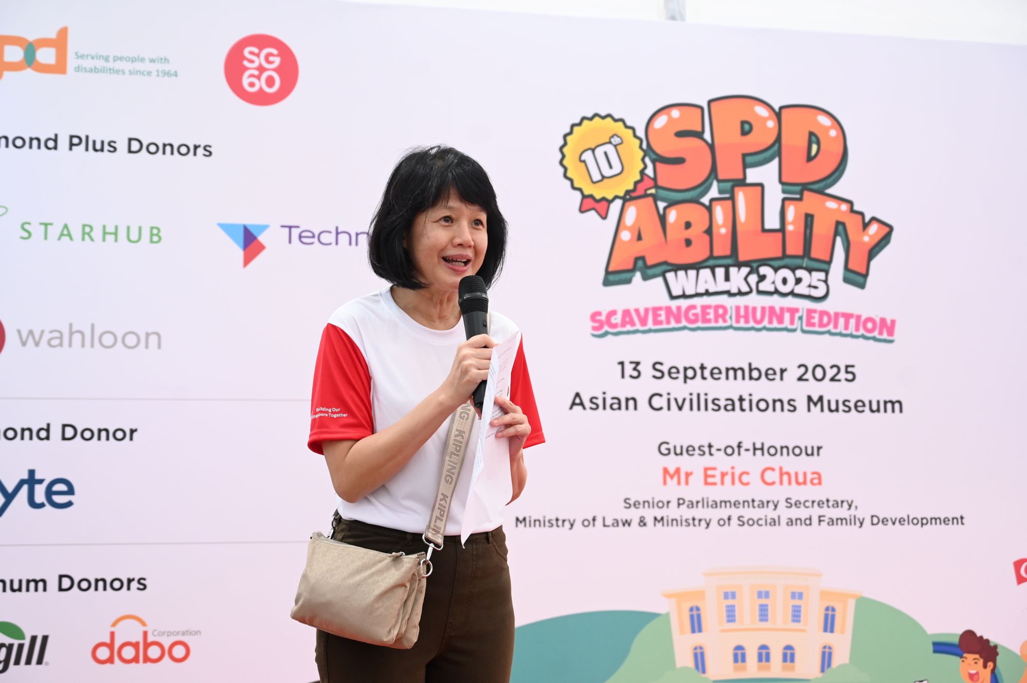 Ms Ong giving a speech at the S P D Ability Walk 2025