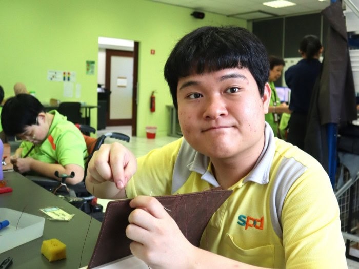Joel sewing at the workshop