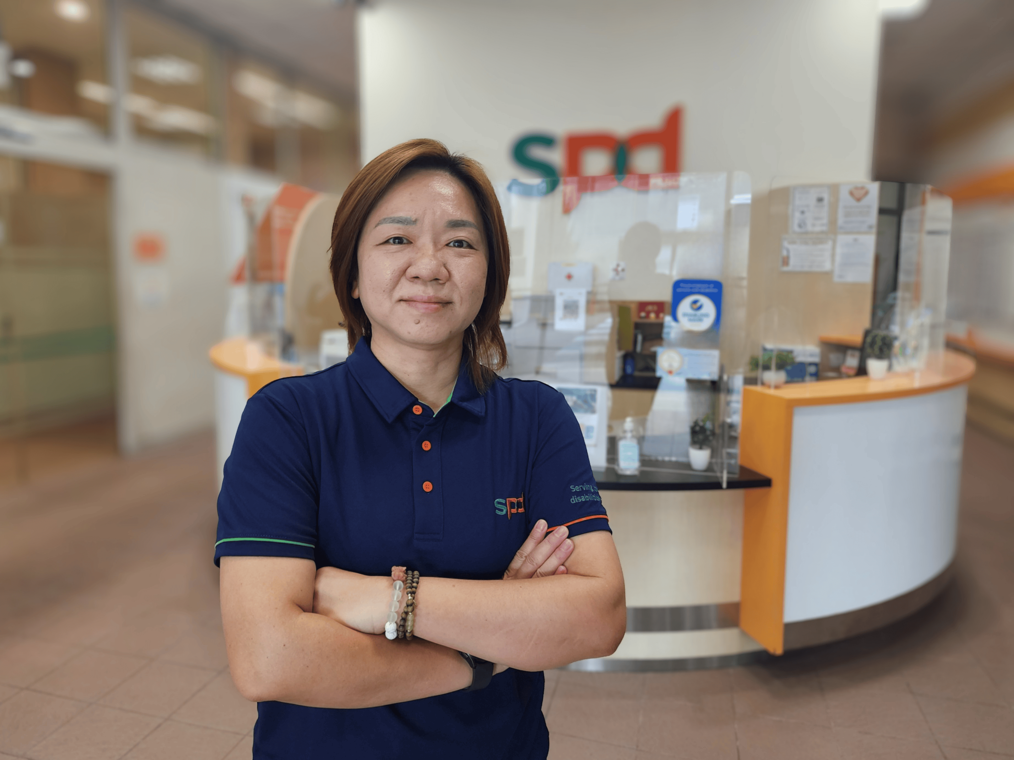 Alexis standing proudly at the S P D Ability centre lobby