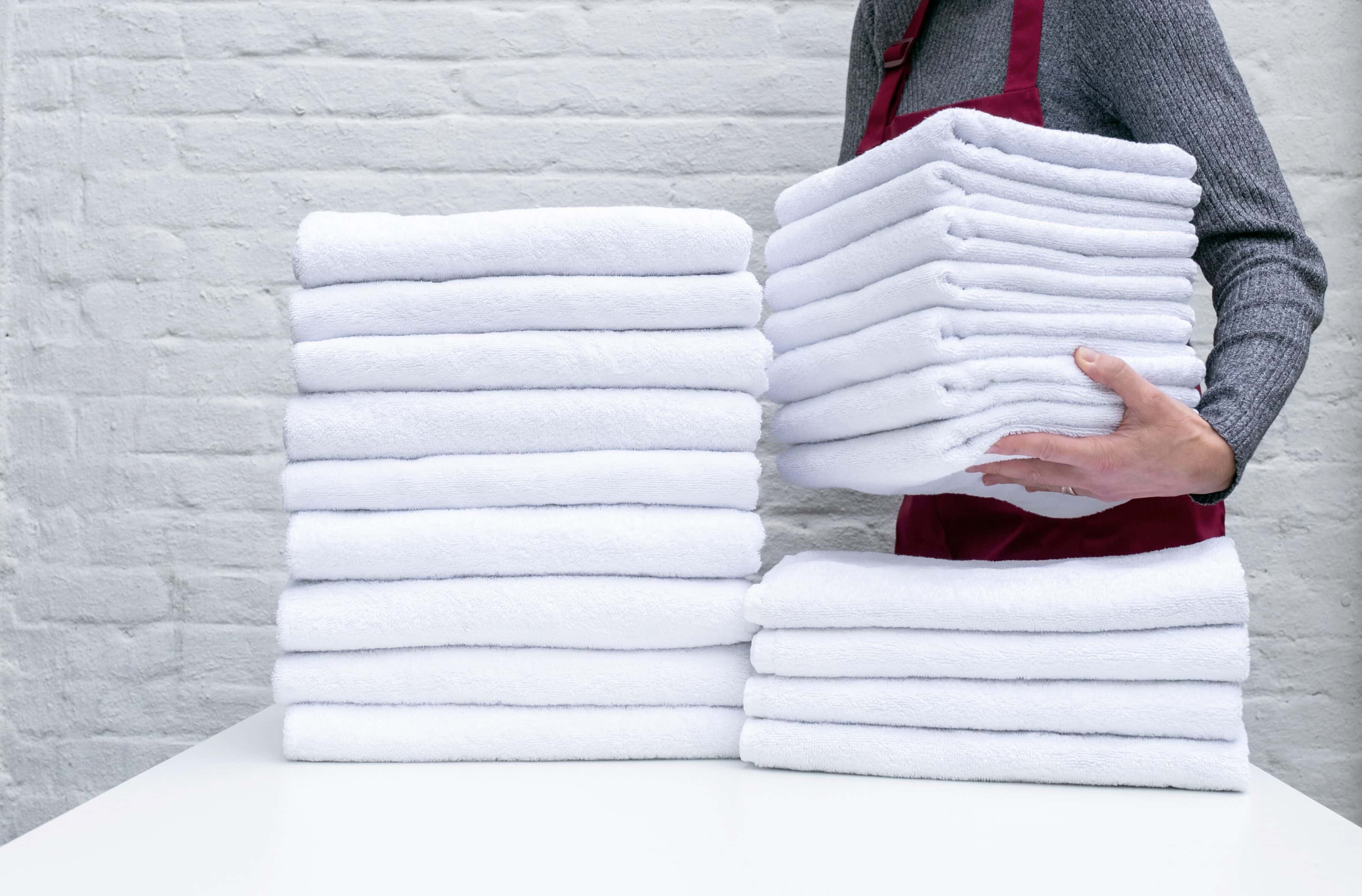 Vocational Training Track 1 A person stacking up folded towels