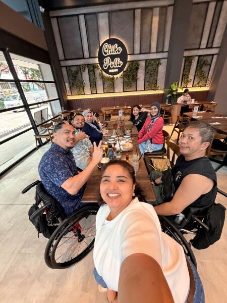 From setback to strength 5 Mr Wong and Mdm Nooraini having lunch at Chiko Pollo with the families of 2 wheelchair rugby team mates