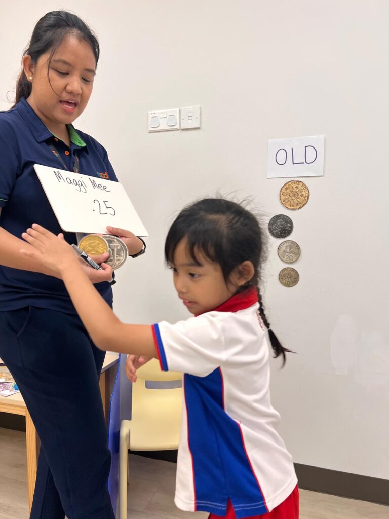 Teachers’ Day Feature: The heart behind every milestone 6 Teacher Czarianne teaching Sofia about money denominations
