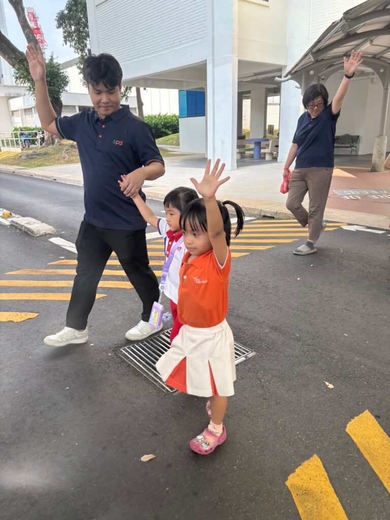 Teachers’ Day Feature: The heart behind every milestone 5 Teacher Fabian and Teacher Joanne crossing the road with Olena and Adelea
