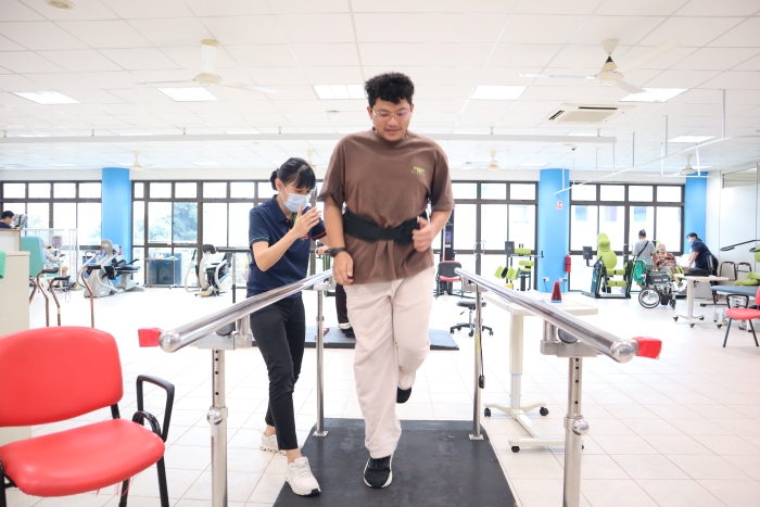 Azhar at the S P D Rehabilitation Centre, practising his jumps under the supervision of a physiotherapist